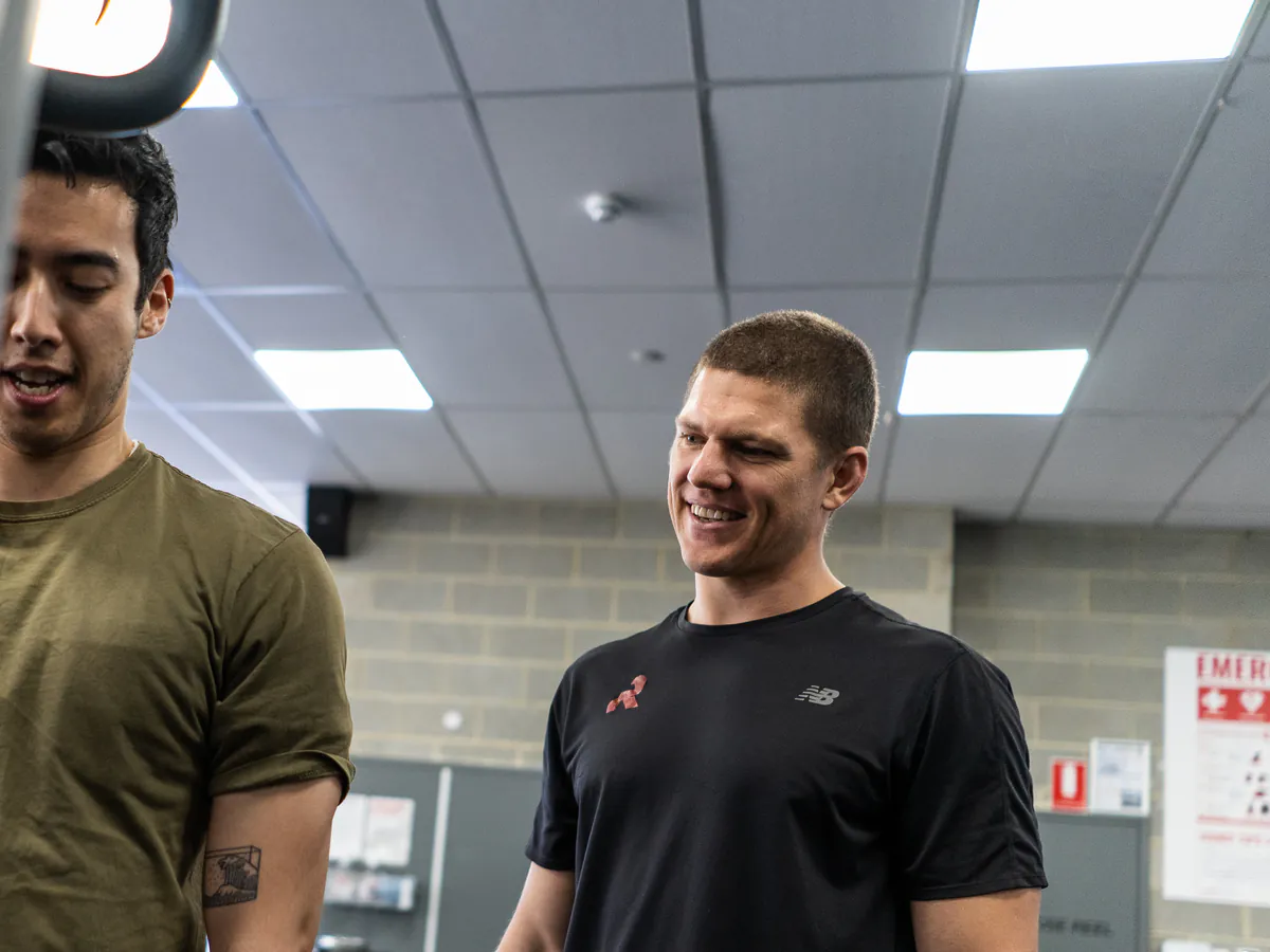A Conditioning Co coach and client talking during a one-to-one training session